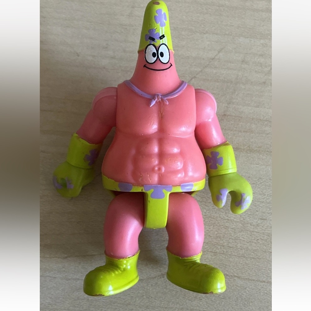 Vibrant Pink and Yellow Action Figure